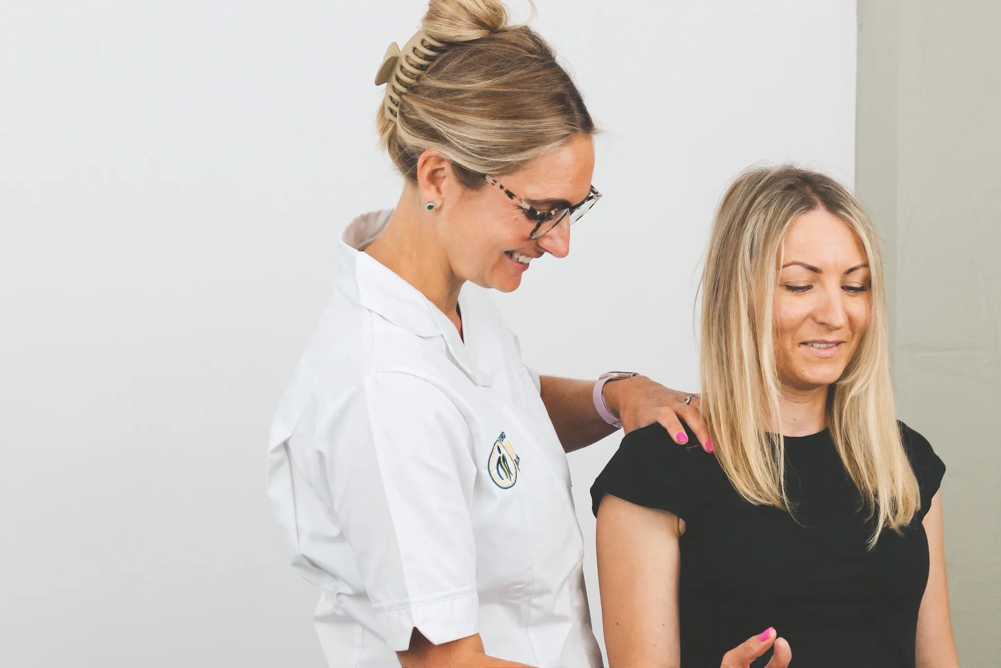 Osteopath assessing a patient's shoulder at Taylor Clifford Health